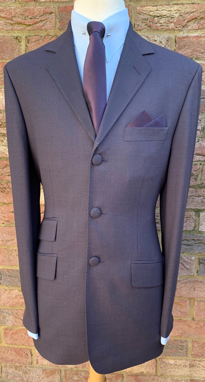 Single Breasted 3 Button Superfine Wool Suit with Cloth Covered Buttons in Mauve-Aubergine.