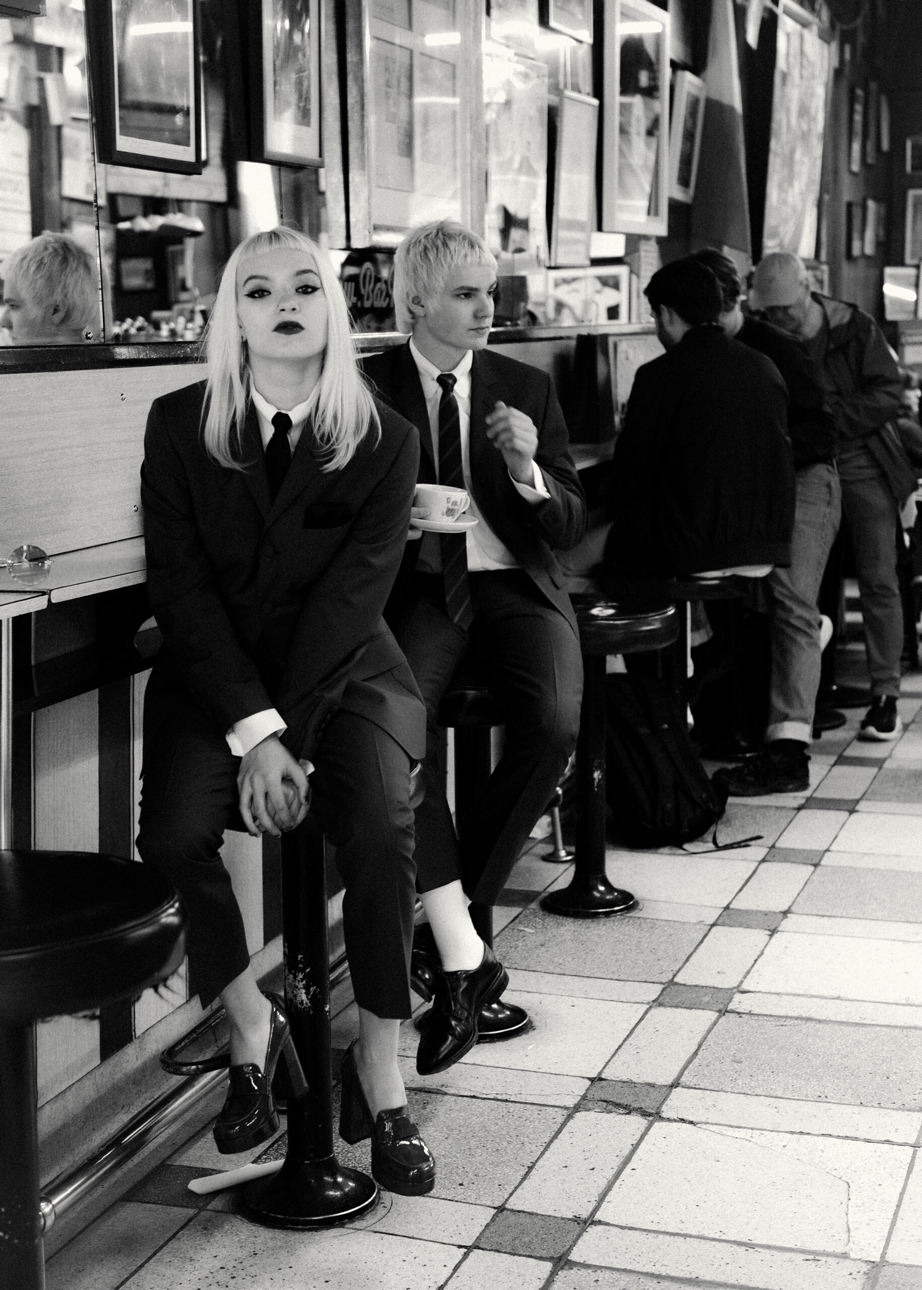 The Molotovs in Bar Italia Soho wearing Adam Of London Suits, photographed by Kane Layland